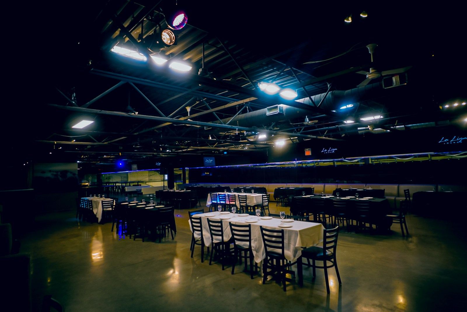 Banquet hall in North York set with long tables for a 250 guest event at La Liga Lounge