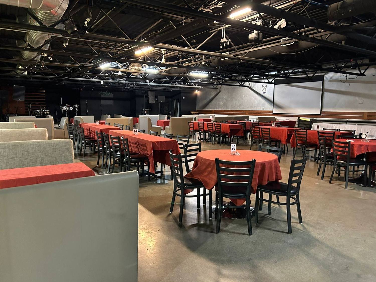 Banquet hall rental in Toronto with round tables and red linen at La Liga Lounge