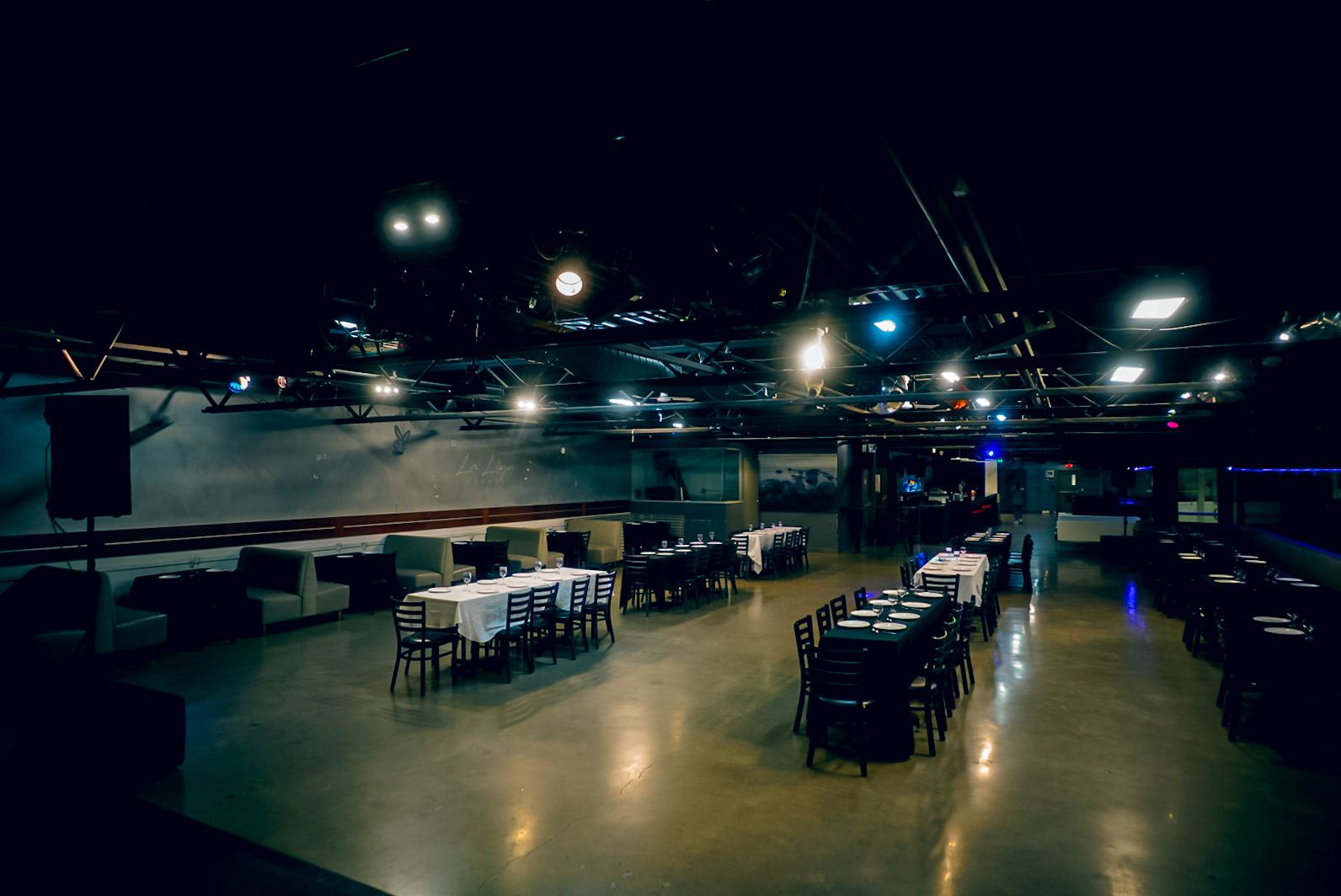 Dark event venue layout at La Liga Lounge Toronto set for a ticketed live show