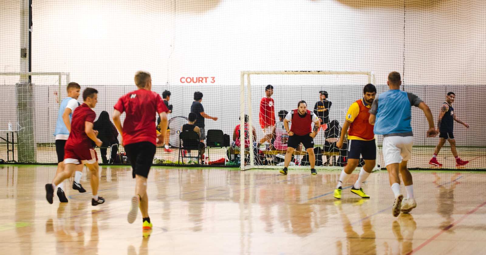 Five a side futsal game on the indoor hardwood court at La Liga Sports Complex North York