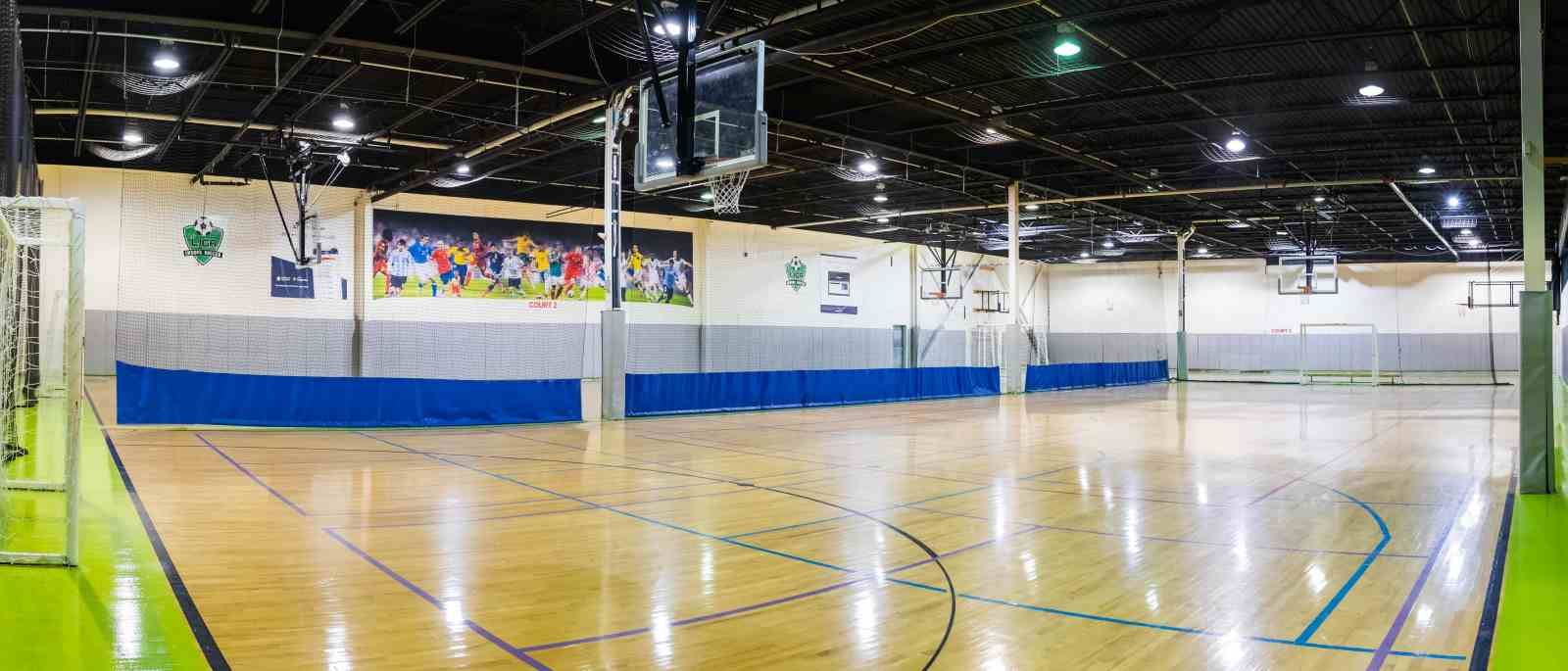 Empty indoor hardwood court 1 measuring 105 by 50 feet at La Liga Toronto