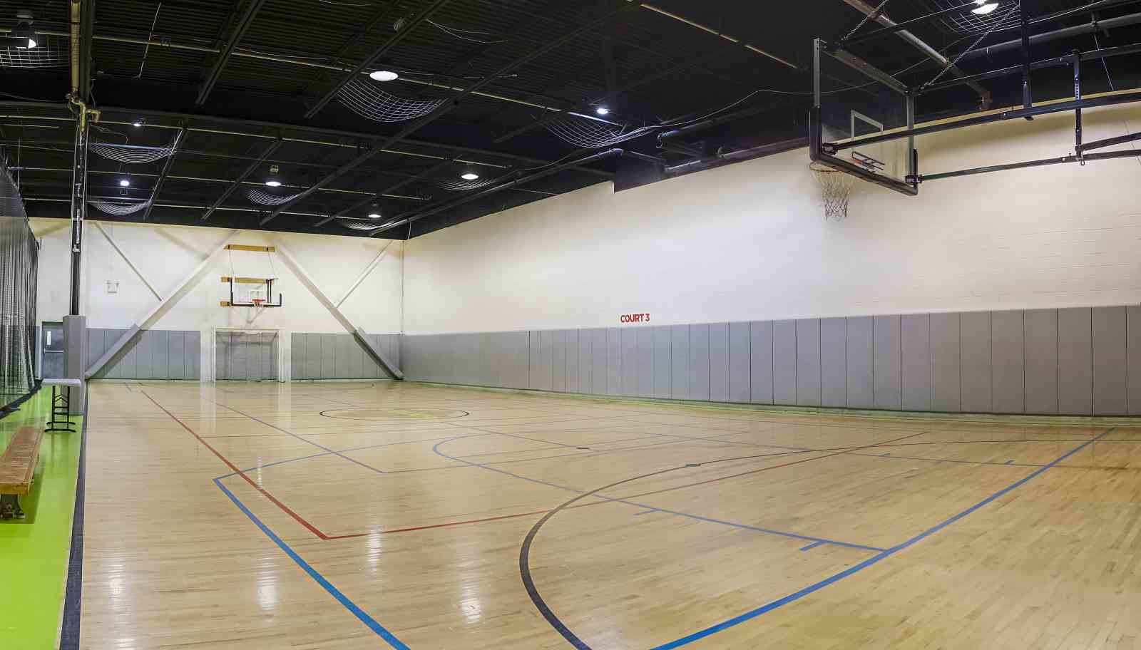 Empty indoor hardwood court 3 measuring 84 by 50 feet at La Liga Toronto