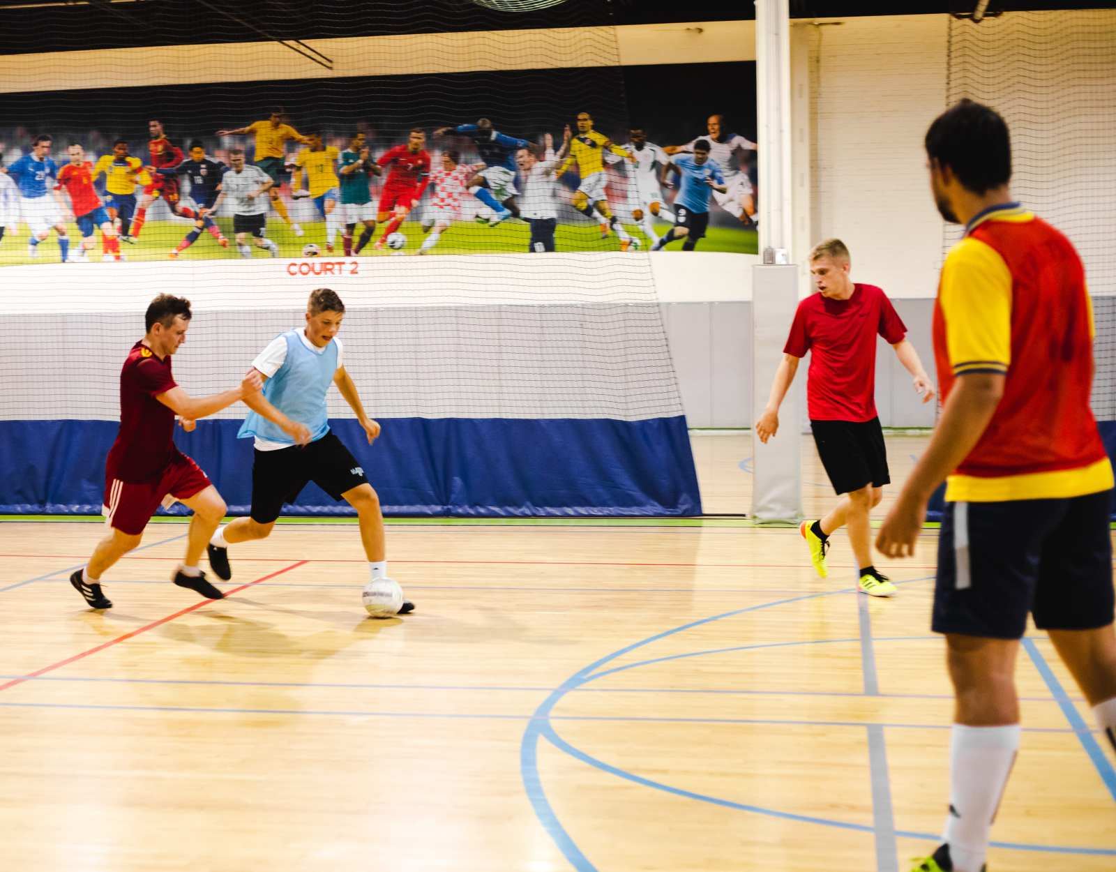 Indoor futsal match on the hardwood court at La Liga Sports Complex Toronto