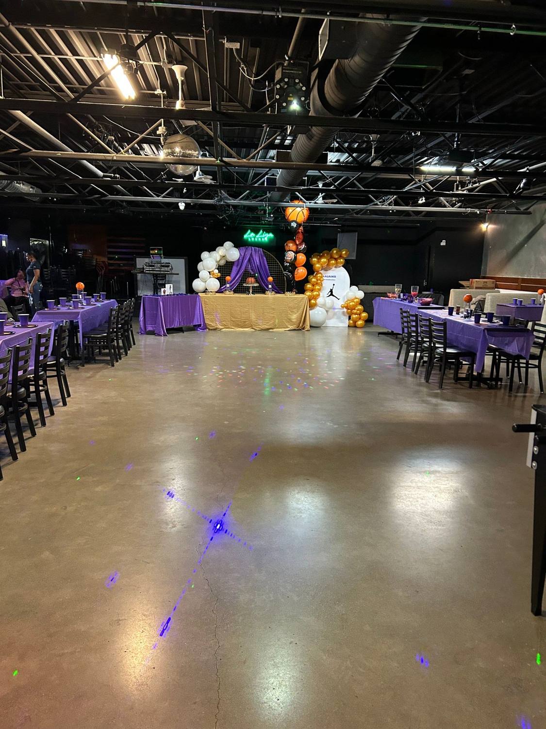 Kids birthday party room in North York with purple table setup and balloons